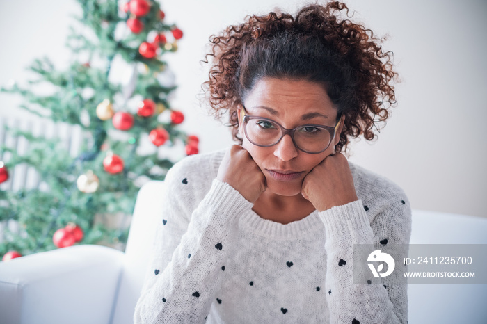 Worried black young woman at home on christmas holiday