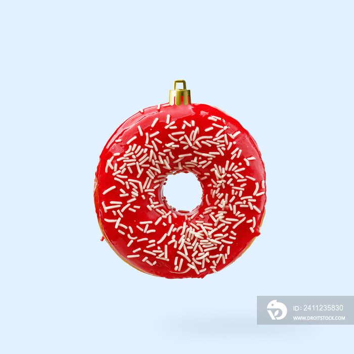 Christmas decoration made from an appetizing donut. Creative concept.