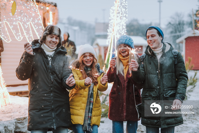 Happy young people enjoying their winter holidays