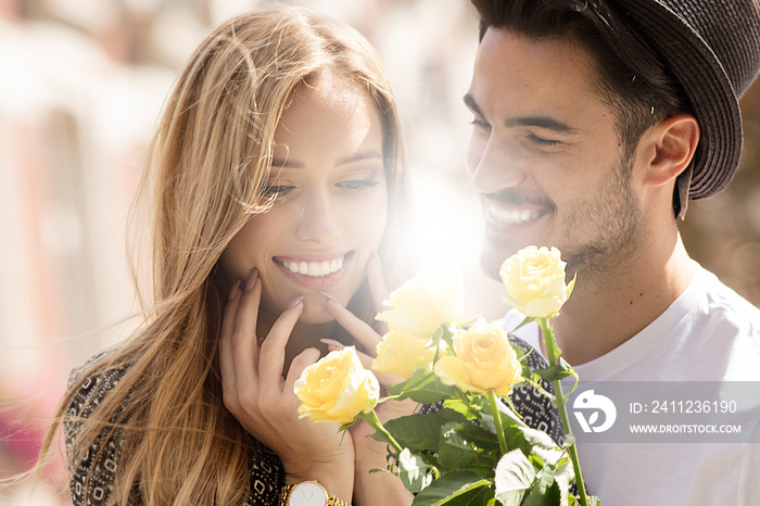 Beautiful couple with flowers dating.