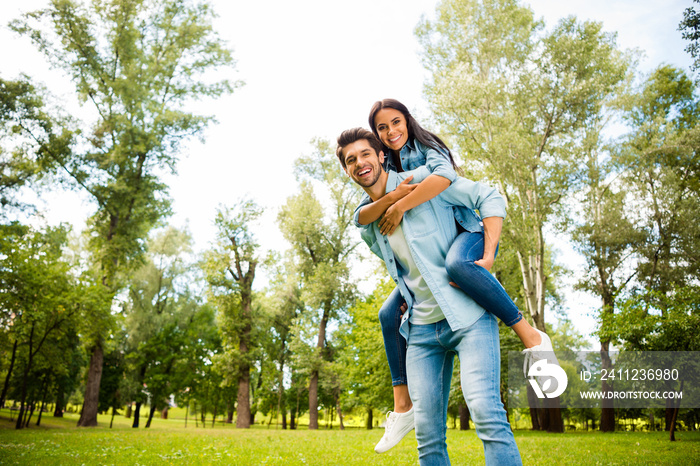 Pretty pair finally having fun vacation together walking green street outside wear denim outfit