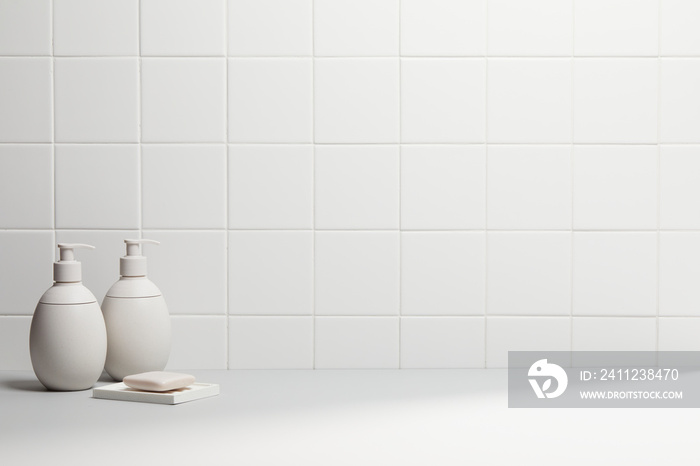 decoration in bathroom with various bath accessories and soft light on white tile wall. copy space a