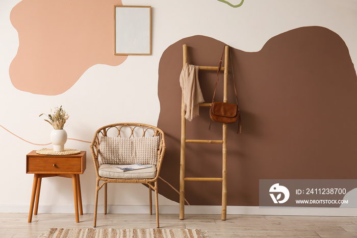 Interior of living room with table, armchair and ladder shelf