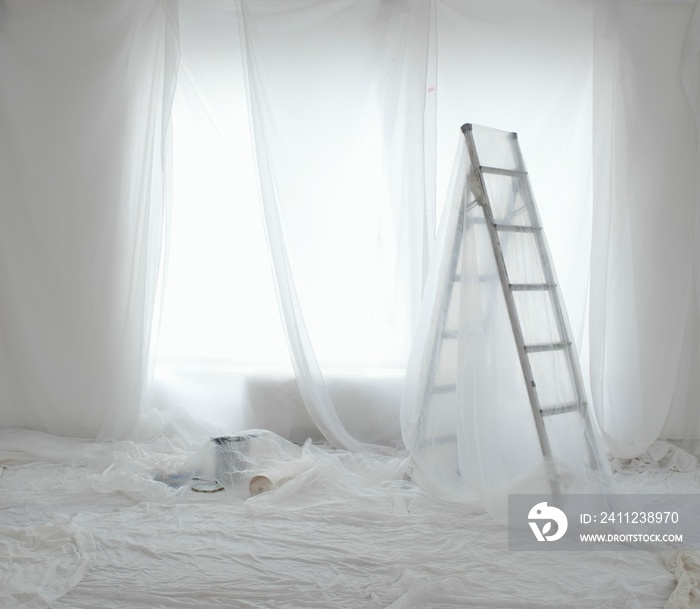 Empty Room Covered In Dust Sheets