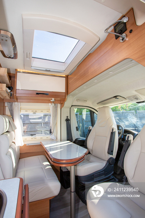 camper van modern white table and seat interior in luxury motorhome on rv vanlife concept