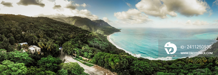 Aerial drone wide panorama of the paradise beach and green mountains with clouds and blue water of Caribbean Sea, Barahona, Dominican Republic