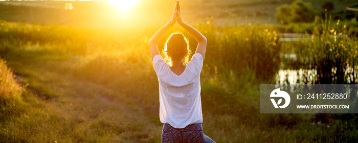 woman in a yoga pose at sunset by lakeside mindfulness and mental health