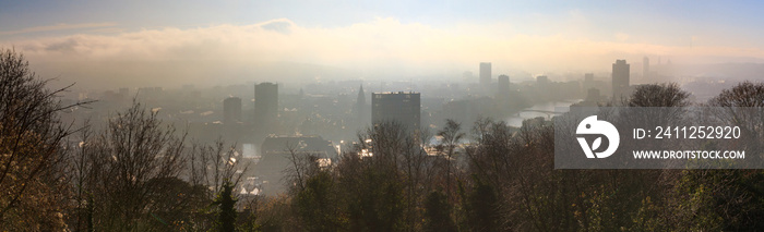 Beautiful cityscape panorama view of the skyline of Liege, Belgium, with the river Meuse on a rainy winter day seen from the top of the Montagne de Bueren