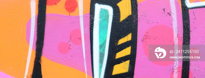 Fragment of a beautiful graffiti pattern in pink and green with a black outline. Street art background image