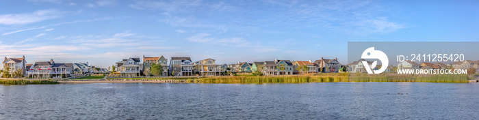 Panoramic view of Oquirrh Lake with homes and sky