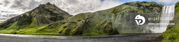 Spectacular Skogafoss Waterfall during a summer day