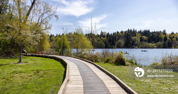 Scenic View of a Path in a vibrant city park by the lake. Spring Season. Deer Lake, Burnaby, Vancouver, British Columbia, Canada.