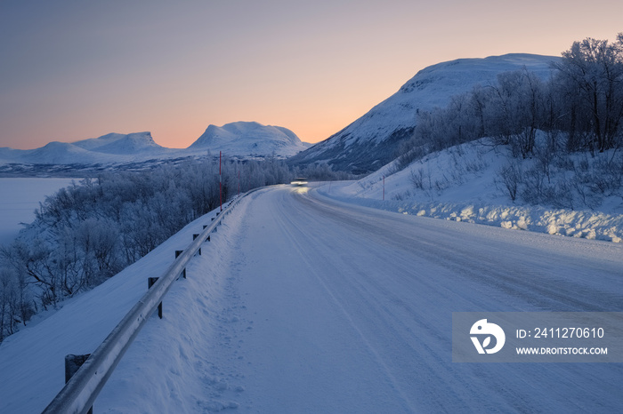 View at the road toward Abisko village in the northen part of Sweden. Landscape of arctic circle area in winter.