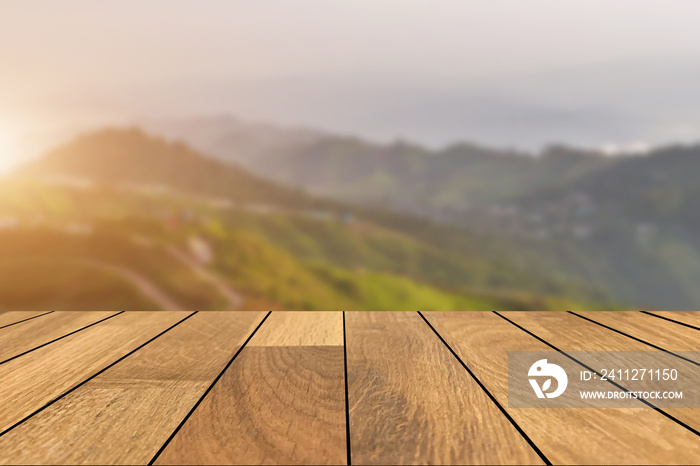 Empty old wooden table in front of blurred beautiful view on top of the mountain and sunrise background. Can be used for display or montage for show your products..