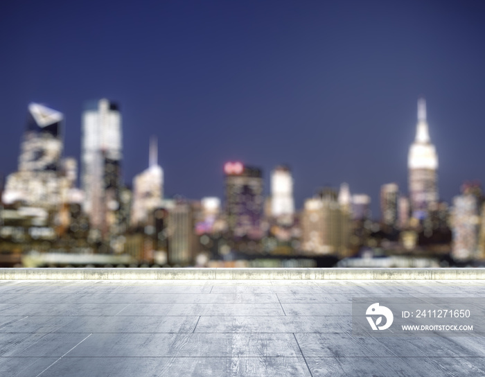 Empty concrete dirty rooftop on the background of a beautiful blurry NY city skyline at night, mockup