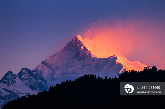 The majestic Kanchenjunga range of the himalayas at first light of sunrise at Sikkim , India