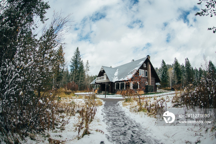 winter landscape with house building n the forest snow