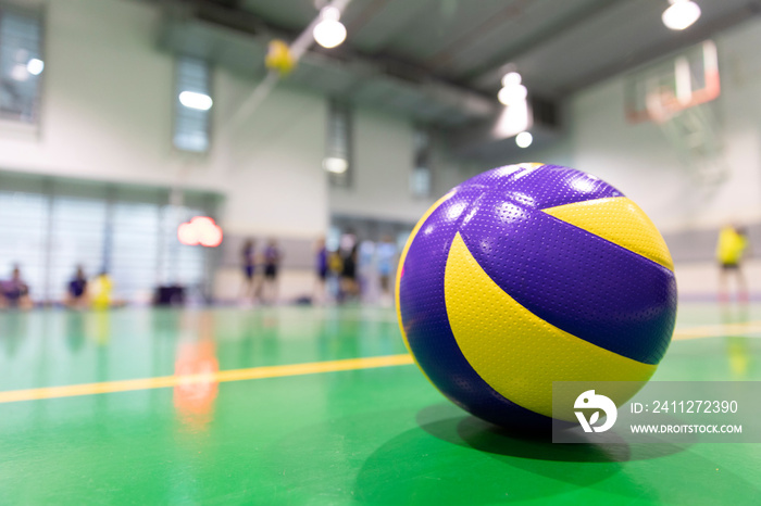 Yellow-blue volleyball spare on the floor