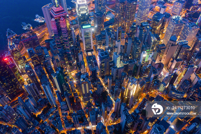 Aerial top view of Hong Kong Downtown, Republic of China. Financial district and business centers in technology smart city in Asia. Top view of skyscraper and high-rise modern buildings at night.