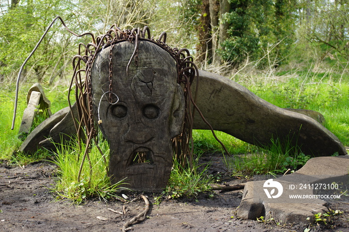 Demon, monster wooden sculpture in Beowulf and Grendel Trail, West Stow Country park Suffolk UK