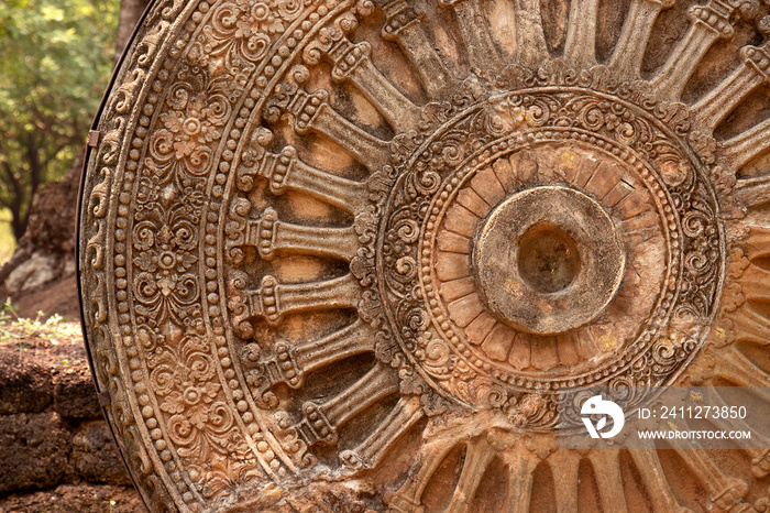 detail of dharmachakra is wheel of dharma or wheel of life, ancient sandstone dharmachakra in the Dvaravati period, symbol of    buddhism entry to Thailand