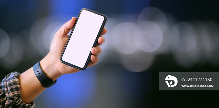 Close-up view of man’s left hand holding blank screen smartphone