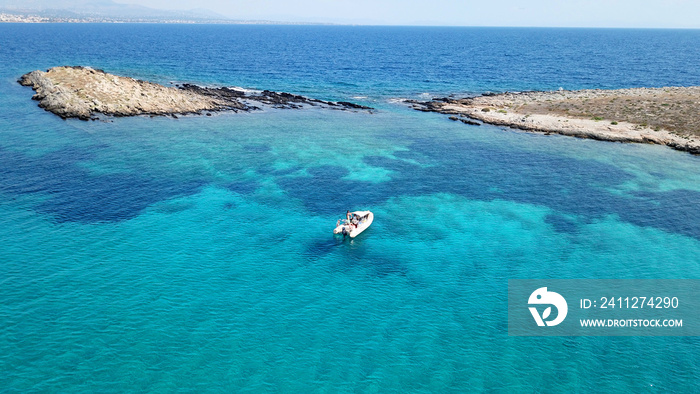 Aerial photo of inflatable boat docked in tropical caribbean island