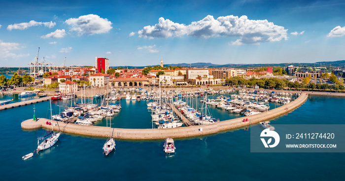 Beautiful summer view from flying drone of Koper port. Sunny outdoor scene of Adriatic coastline, Slovenia, Europe. Splendid Mediterranean seascape. Traveling concept background.