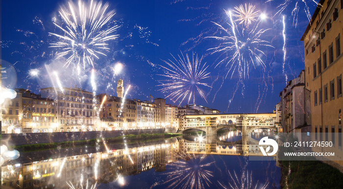 celebrating New year’s eve in Florence, Italy - explosive fireworks around ponte vecchio on river arno