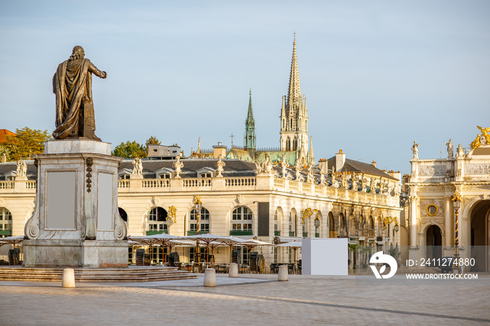 Cityscape view on the central square with beautiful buildings and cathedral tower in Nancy, France