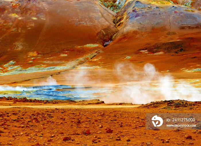 Martian surreal landscape of Hverir geothermal valley in Iceland, Namafjall volcano mountain, colorful ground, steam vents, mud pools, fumaroles. Fantastic Icelandic nature.