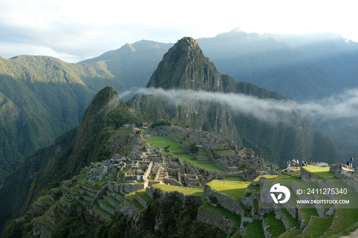 Sunrise at Machu Picchu with misty line