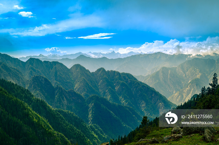 Mountain landscape with clouds, meadows. Himalayas peaks & alpine l from the trail of Sar Pass trek  Himalayan region of Kasol, Himachal Pradesh, India.