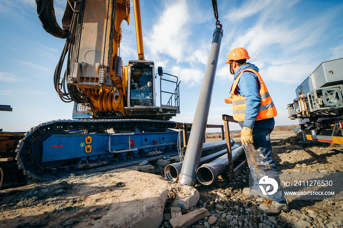 Workers start construction of a concrete bridge