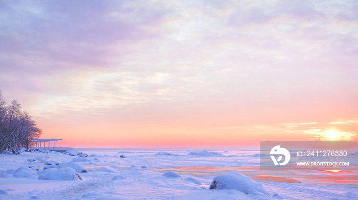 The harsh Northern winter landscape with sunset.