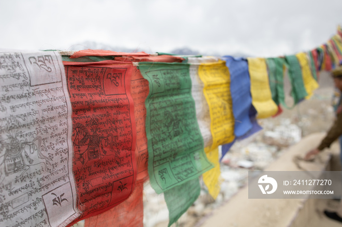 Buddhist Tibetan prayer flag colorful flag different in five color different meaning, Leh Ladakh, India on background of Himalaya mountain.