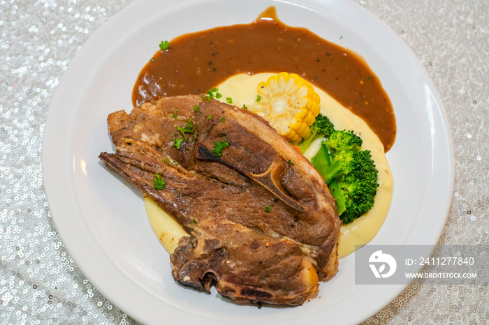 Grilled Lamb Chops with broccoli, corn, mashed potato and black pepper sauce