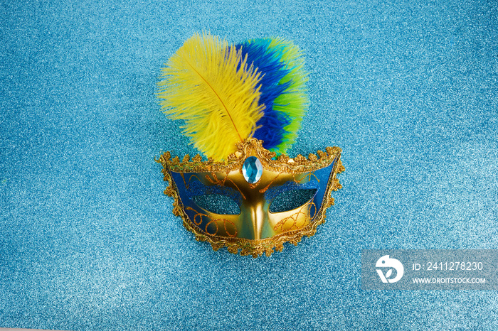 Carnival mask in Brazilian colors for carnaval holiday background concept.