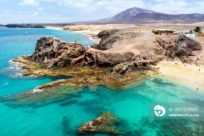 Beautiful Papagayo Beach with white sand and black rocks on Lanzarote, Canary Islands, Spain