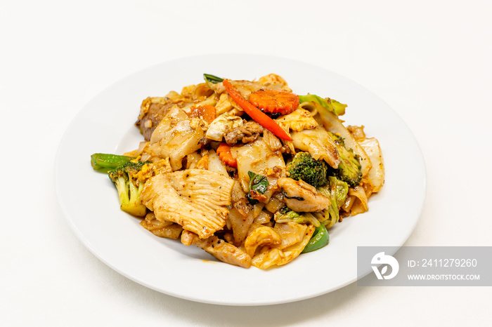 Drunken noodles or pad kee mao is a stir fried noodle dish on white background,Thai food.