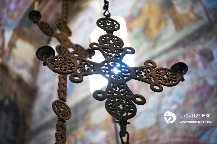 A beautiful decorated golden cross in a Serbian Orthodox church. The interior of a Christian Orthodox church. Sopocani monastery in Serbia.