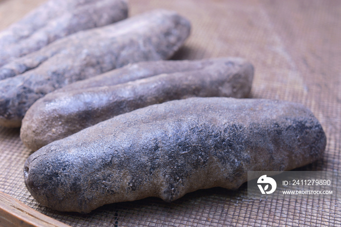 Dried sea cucumber covered by salt.