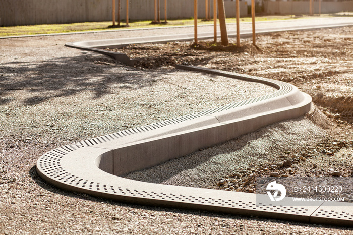 Concrete Curbs Spiral Shape of Sidewalk or Pedestrian Path under Construction in Park. Design Landscape Park