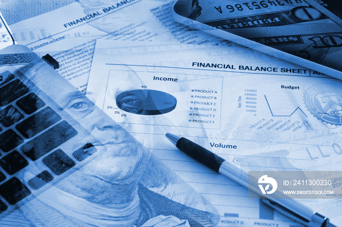 Double exposure Us banknote with Financial paper and work station on working table, Finance concept.