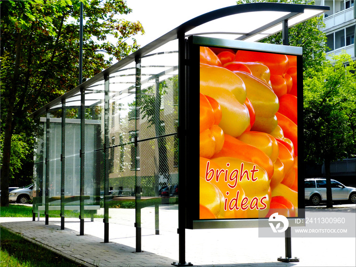 bus shelter at transit stop. composite image of blank light with colorful sample poster ad place holder. background image for mockup. advertising concept.