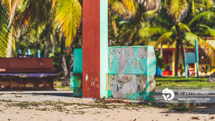 Colorful Concrete Ruins on tropical beach damaged from hurricane