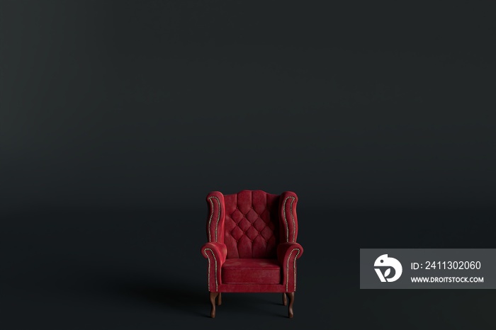 Red velvet armchair of old design on short legs with high back isolated on black background.