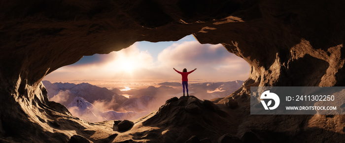 Dramatic Adventurous Scene with Woman standing inside a Rocky Cave Landcspae. 3d Rendering. Sunset Sky. Aerial Mountain Image from British Columbia, Canada. Adventure Concept