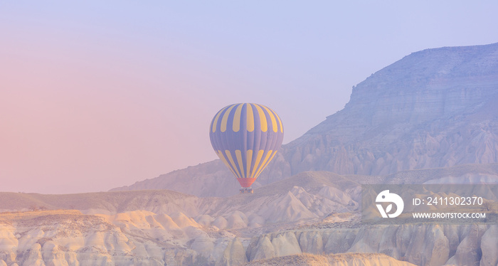 Landscape sunrise in Cappadocia with set colorful hot air balloon fly in sky with sun light. Concept banner tourist travel Goreme Turkey