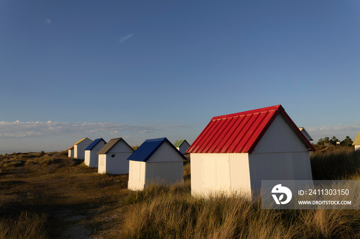 Beach cabins in Gouville sur Mer, Manche, Normandy, France in various lights